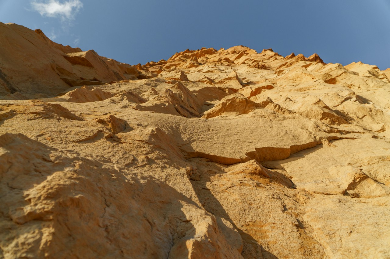 Eroded sandstone cliffs exposing geological layers
