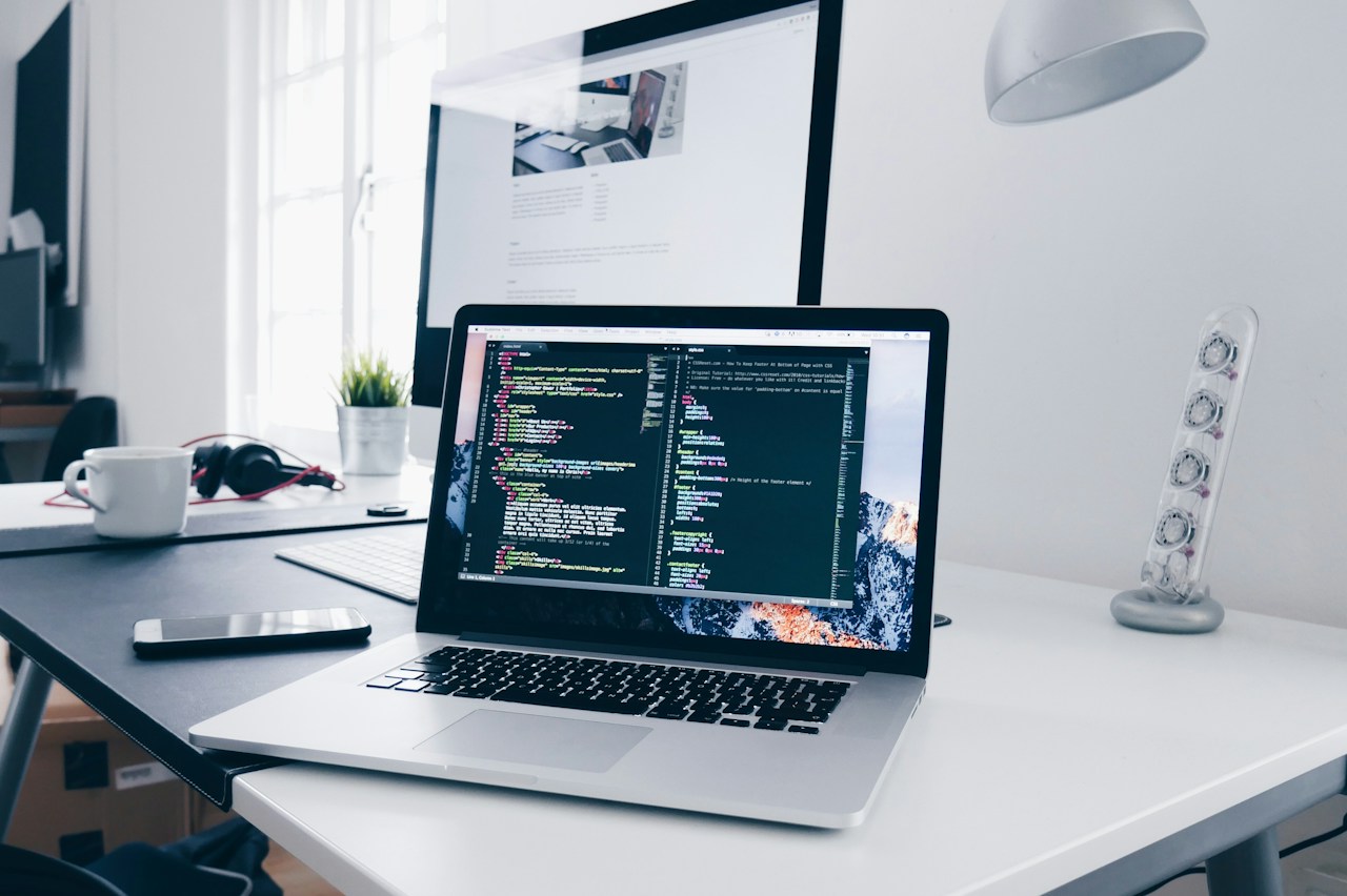 Developer working at a laptop in a modern workspace
